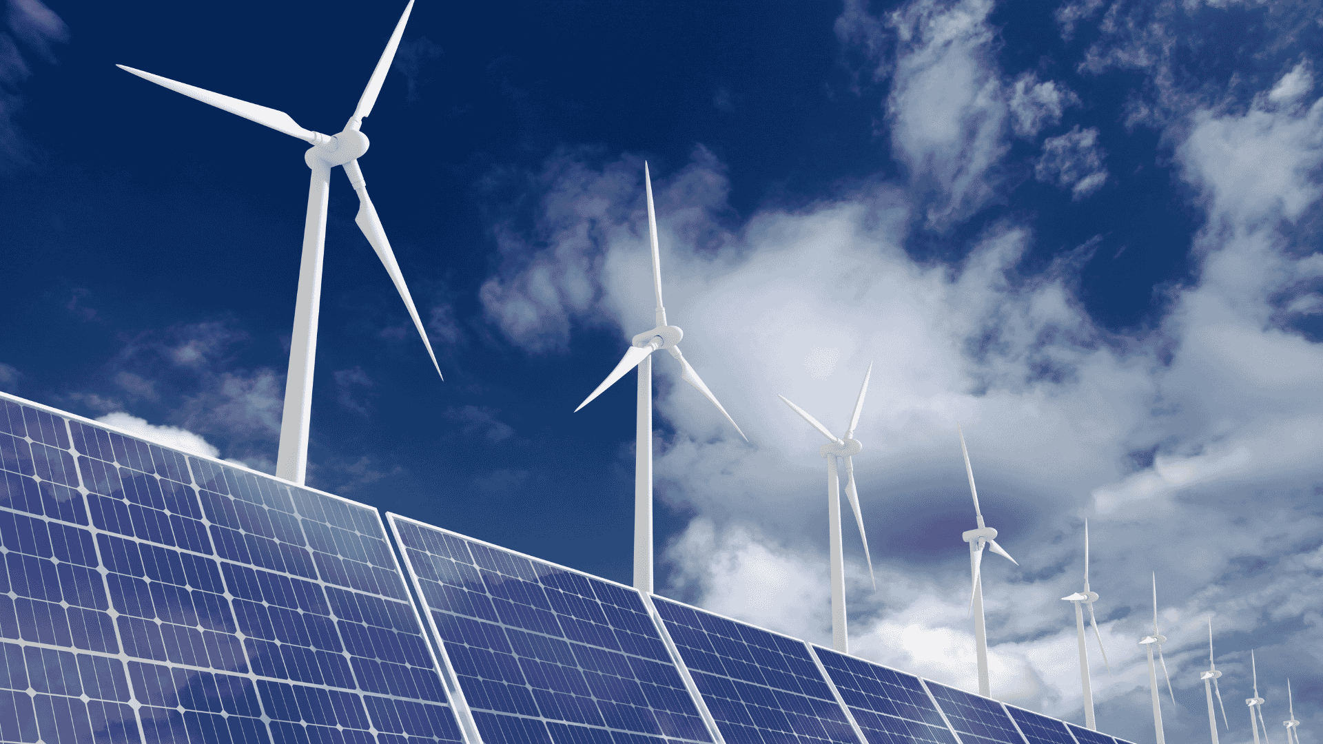 Wind turbines and solar panels next to each other